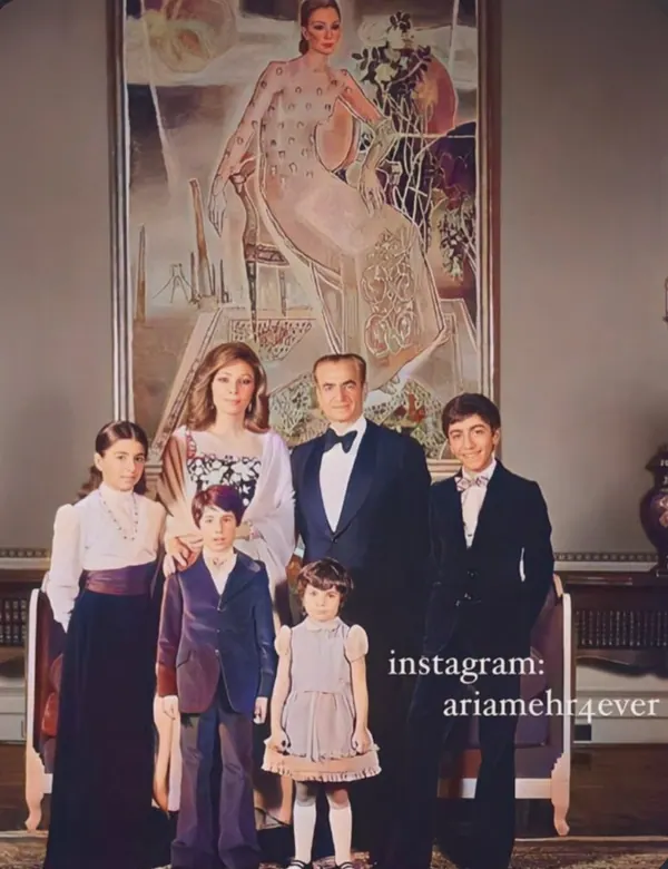 A family of five poses in formal attire before a large painting of Farah Pahlavi, Empress of Iran, — a public domain photograph from The Shah of Iran archive documenting the Pahlavi era.