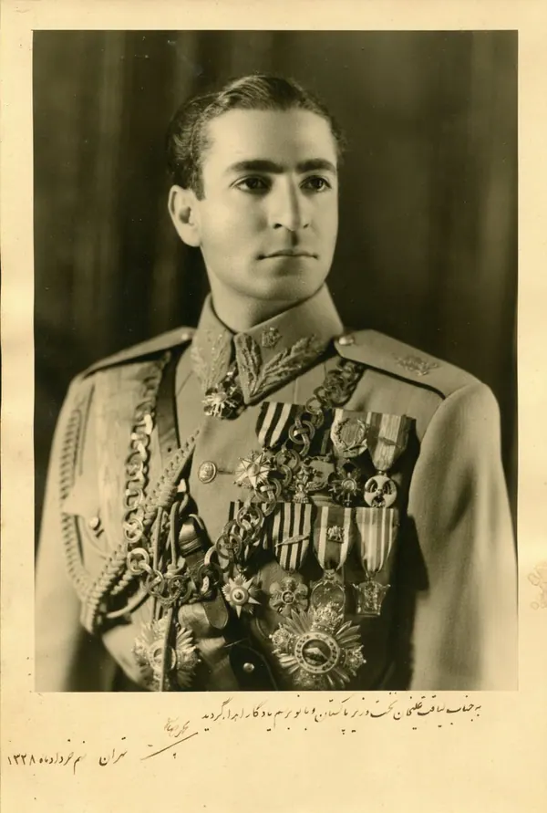 His Majesty, the Shah of Iran in a decorated military uniform with numerous medals and a sash poses for a portrait — a public domain photograph from The Shah of Iran archive documenting the Pahlavi era.