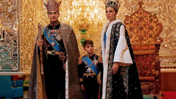 His Majesty, the Shah of Iran, woman, and boy wear ornate royal attire and crowns in a lavishly decorated room — a public domain photograph from The Shah of Iran archive documenting the Pahlavi era.