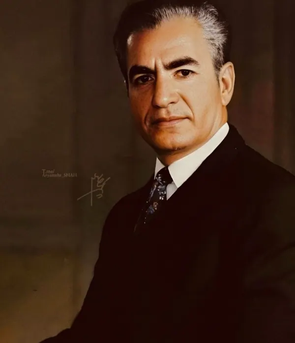 His Majesty, the Shah of Iran in a dark suit and patterned tie poses for a studio portrait — a public domain photograph from The Shah of Iran archive documenting the Pahlavi era.