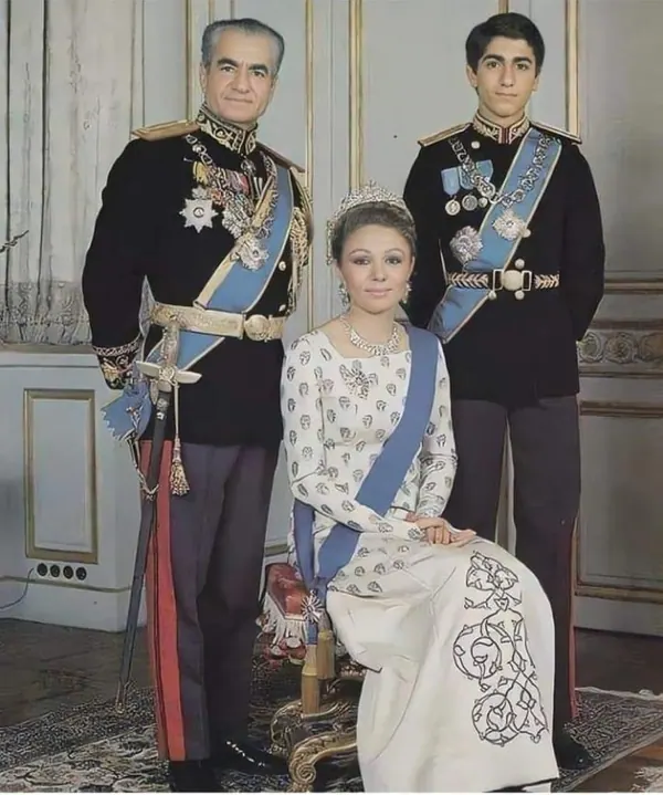 His Majesty, the Shah of Iran, and others in dark military uniforms and Farah Pahlavi, Empress of Iran, in a white gown pose for a formal portrait — a public domain photograph from The Shah of Iran archive documenting the Pahlavi era.